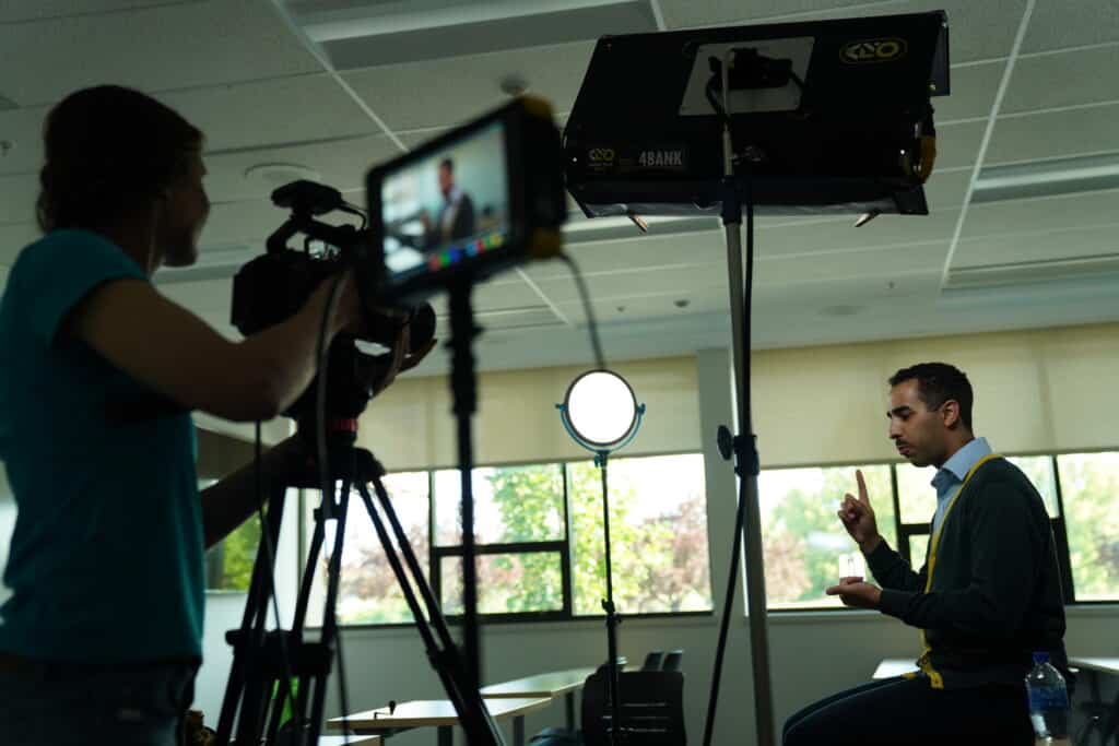 Team Member at Rogue Heart Media Filming a Documentary