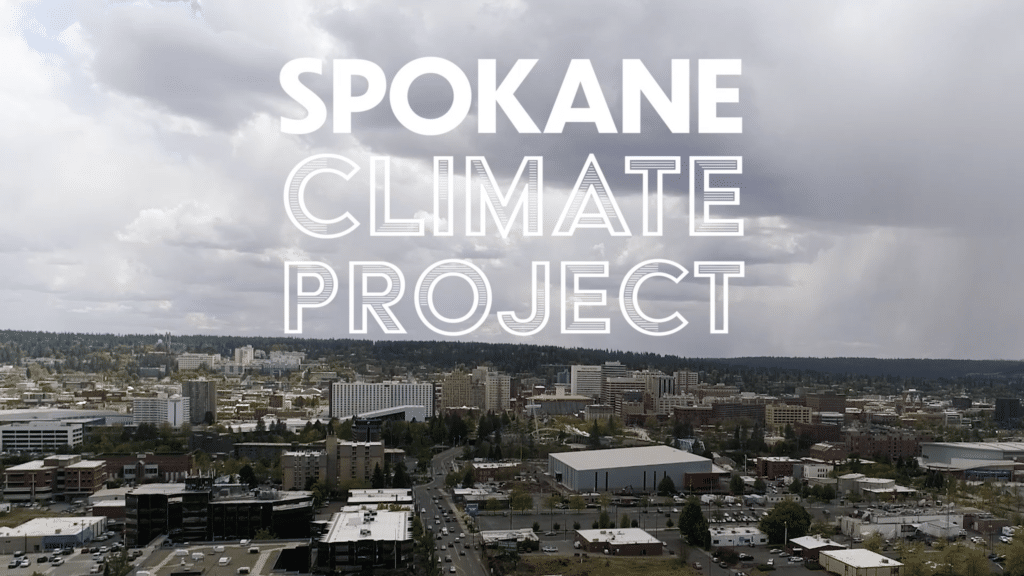 Aerial view of the city of Spokane with the words "Spokane Climate Project" centered on the image